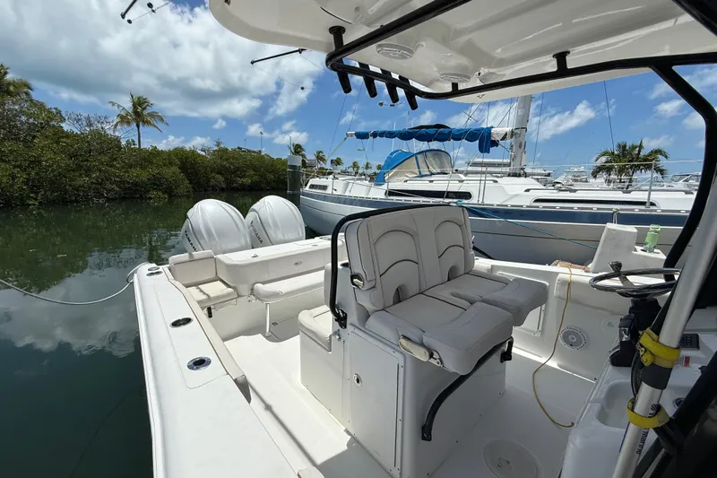 Afterthought Yacht Photos Pics 2022 Sea Hunt Gamefish 30 Coffin Box boat docked, featuring dual engines and spacious seating.