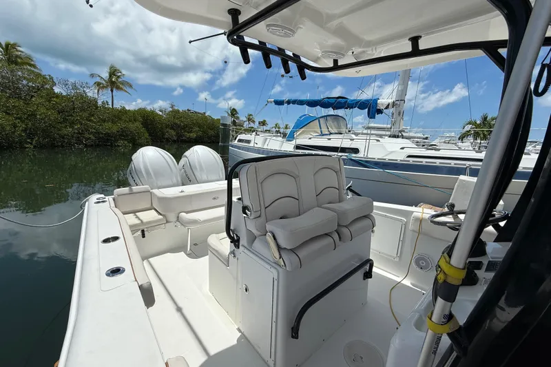 Afterthought Yacht Photos Pics 2022 Sea Hunt Gamefish 30 Coffin Box boat with dual engines docked in a marina.