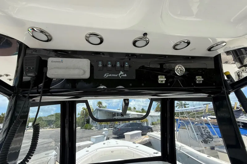 Afterthought Yacht Photos Pics 2022 Sea Hunt Gamefish 30 Coffin Box boat console with Garmin electronics and control panel.