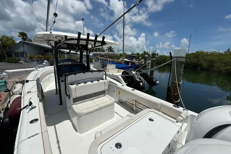 Afterthought Yacht Photos Pics 2022 Sea Hunt Gamefish 30 Coffin Box boat docked, featuring spacious seating and modern design.