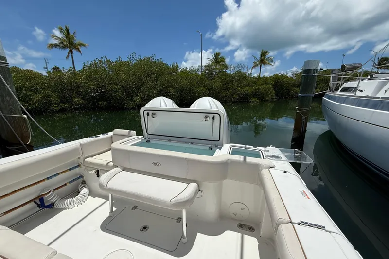 Afterthought Yacht Photos Pics 2022 Sea Hunt Gamefish 30 Coffin Box boat docked, featuring spacious seating and storage.
