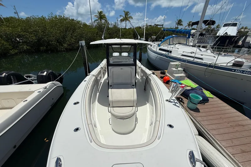 Afterthought Yacht Photos Pics 2022 Sea Hunt Gamefish 30 Coffin Box boat docked, surrounded by other vessels.