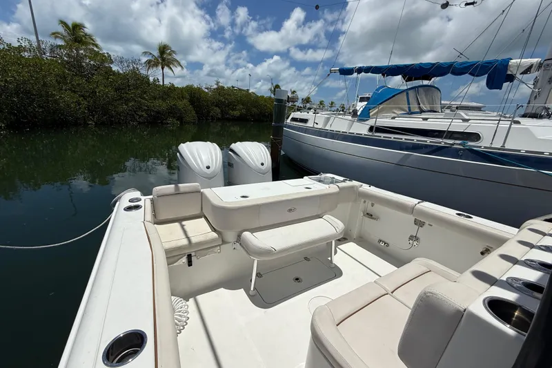 Afterthought Yacht Photos Pics 2022 Sea Hunt Gamefish 30 Coffin Box boat docked, featuring dual engines and spacious seating.