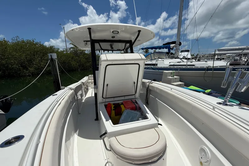 Afterthought Yacht Photos Pics 2022 Sea Hunt Gamefish 30 Coffin Box boat docked, open storage, sunny day.