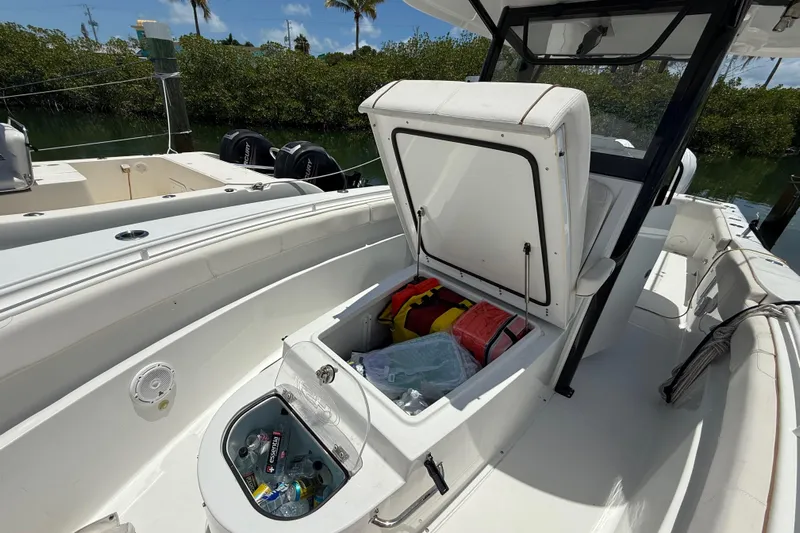 Afterthought Yacht Photos Pics 2022 Sea Hunt Gamefish 30 Coffin Box with open storage, docked near mangroves.