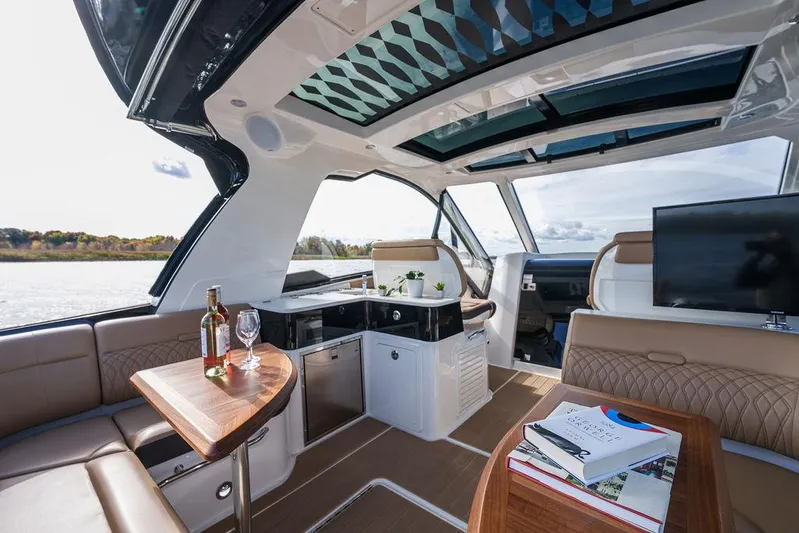  Yacht Photos Pics Luxurious interior of 2023 Sea Ray Sundancer 370 Outboard with elegant seating and modern amenities.