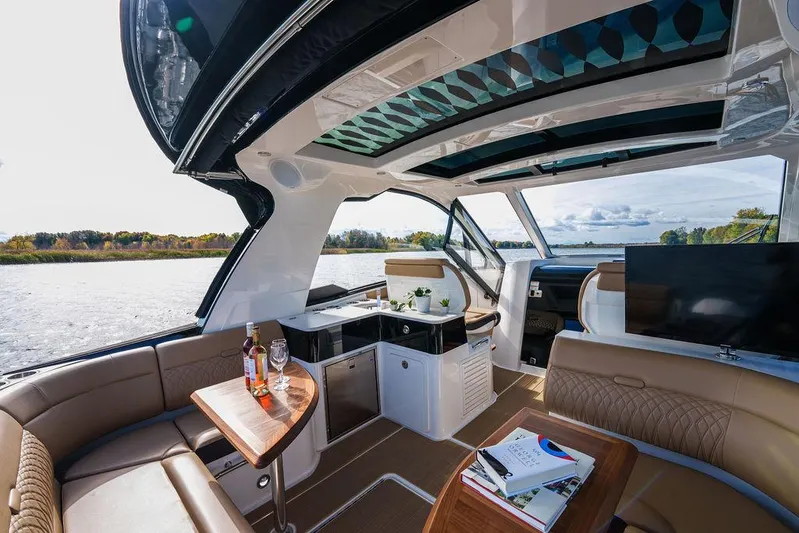  Yacht Photos Pics 2023 Sea Ray Sundancer 370 Outboard interior with luxurious seating and scenic water view.