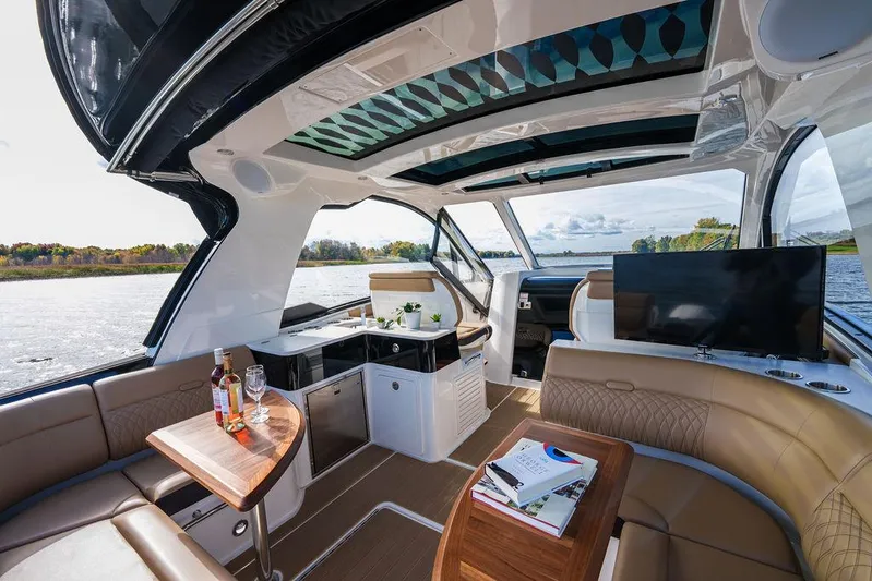  Yacht Photos Pics Luxurious interior of 2023 Sea Ray Sundancer 370 Outboard with scenic water view.