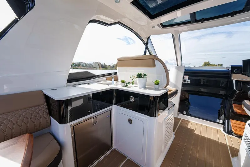  Yacht Photos Pics 2023 Sea Ray Sundancer 370 Outboard interior with modern kitchen and seating area.