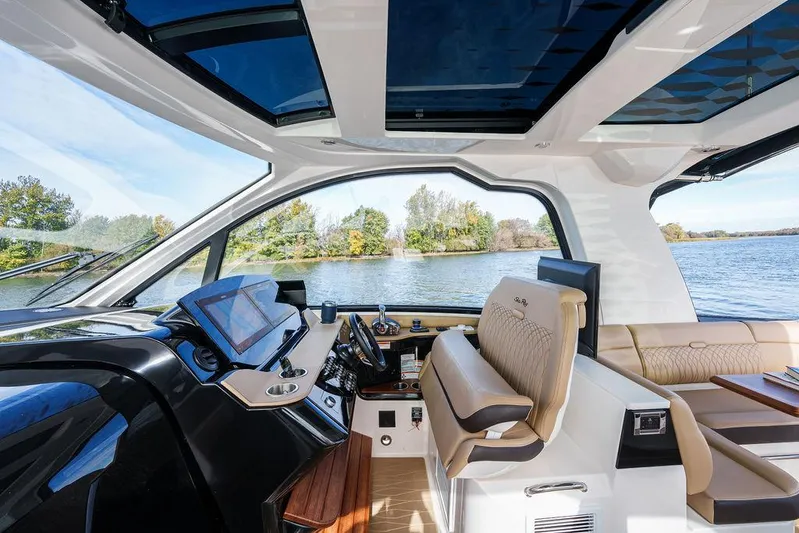  Yacht Photos Pics Luxurious interior of 2023 Sea Ray Sundancer 370 Outboard with scenic water view.