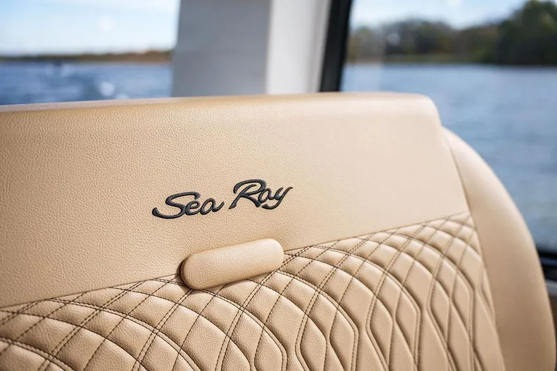  Yacht Photos Pics 2023 Sea Ray Sundancer 370 Outboard, luxurious beige interior detail with logo.