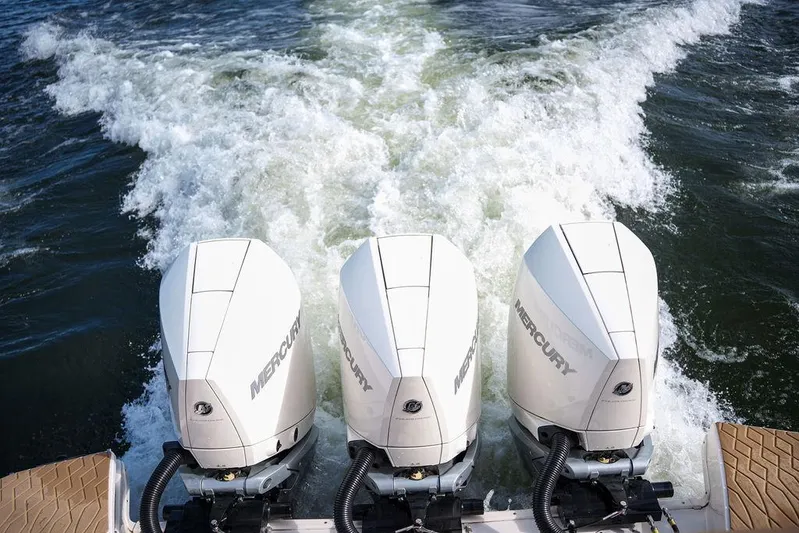  Yacht Photos Pics 2023 Sea Ray Sundancer 370 Outboard with triple Mercury engines on water.