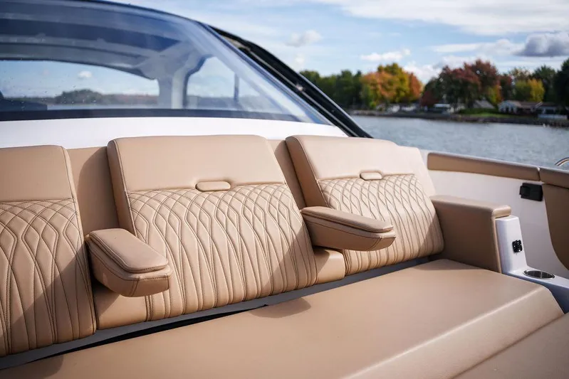  Yacht Photos Pics 2023 Sea Ray Sundancer 370 Outboard, luxurious tan seating, scenic water backdrop.