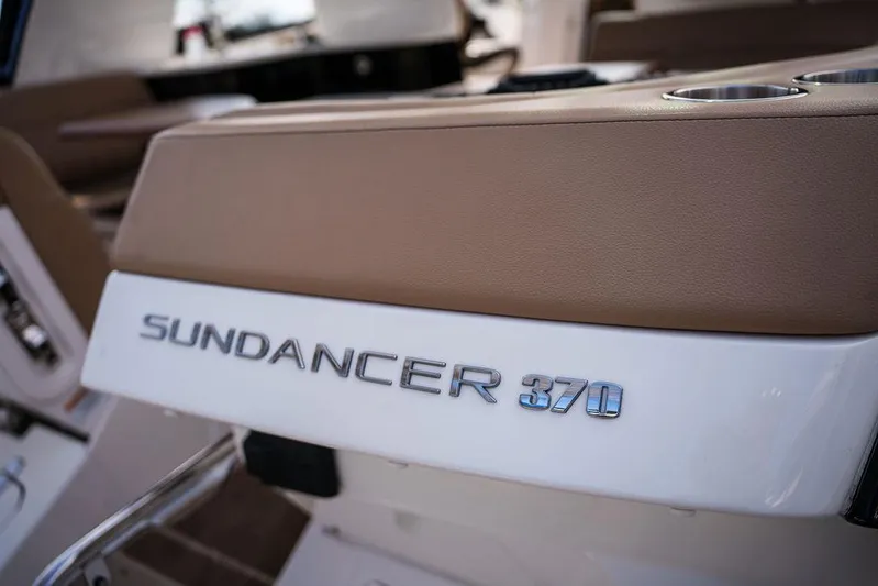  Yacht Photos Pics 2023 Sea Ray Sundancer 370 Outboard logo on boat interior, featuring sleek design elements.