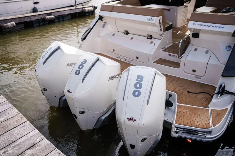  Yacht Photos Pics 2023 Sea Ray Sundancer 370 Outboard with triple Mercury engines docked at marina.