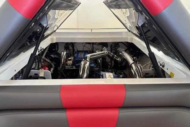  Yacht Photos Pics Engine compartment of a 2006 Fountain 42 Lightning boat with red and gray upholstery.