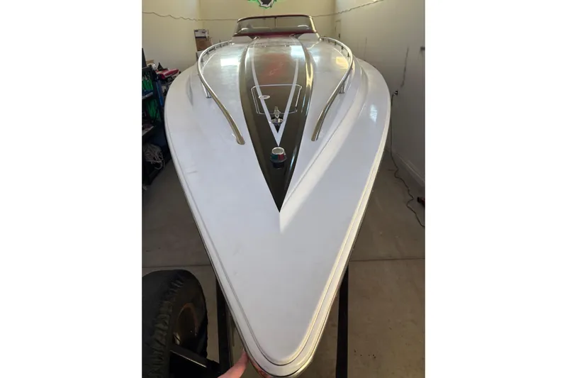  Yacht Photos Pics 2006 Fountain 42 Lightning boat, sleek white hull, stored indoors.