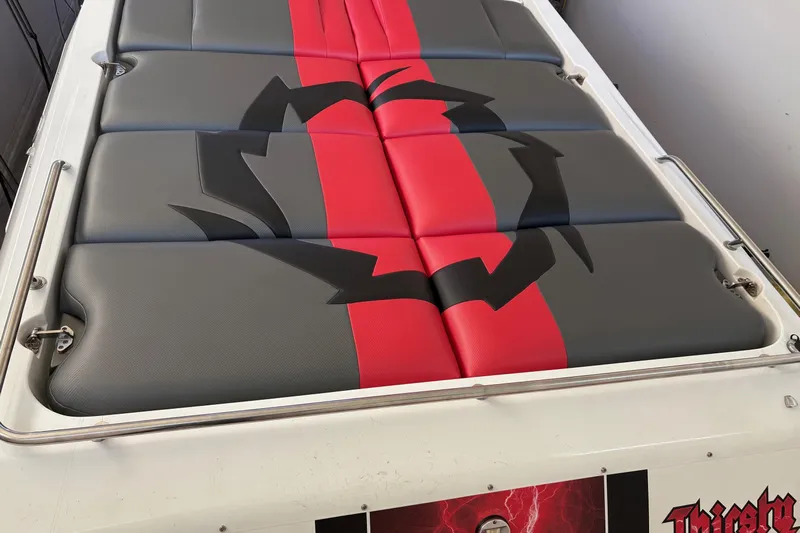  Yacht Photos Pics 2006 Fountain 42 Lightning boat seat with red and gray design, featuring a bold graphic.