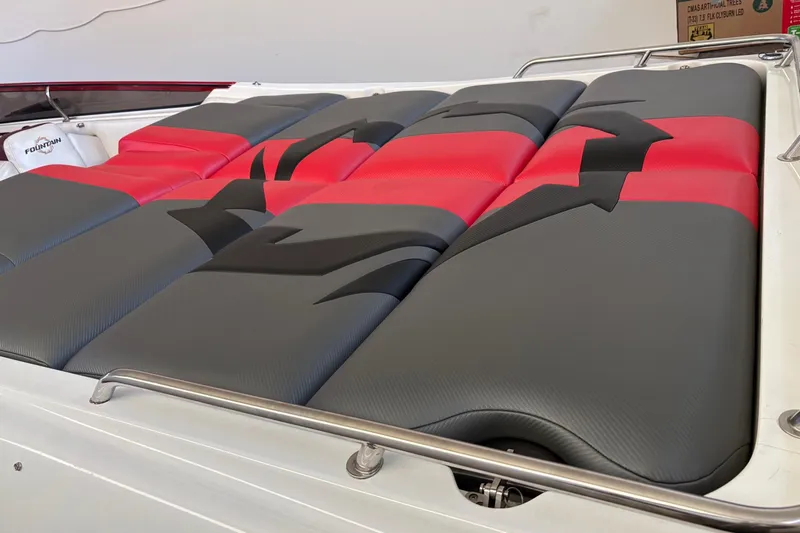  Yacht Photos Pics 2006 Fountain 42 Lightning boat with red and gray cushioned seating.