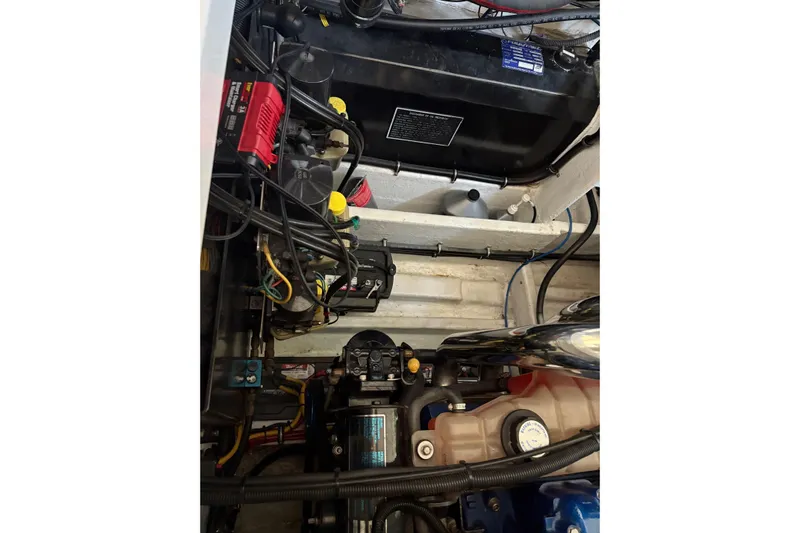  Yacht Photos Pics Engine compartment of a 2006 Fountain 42 Lightning boat, showcasing wiring and components.