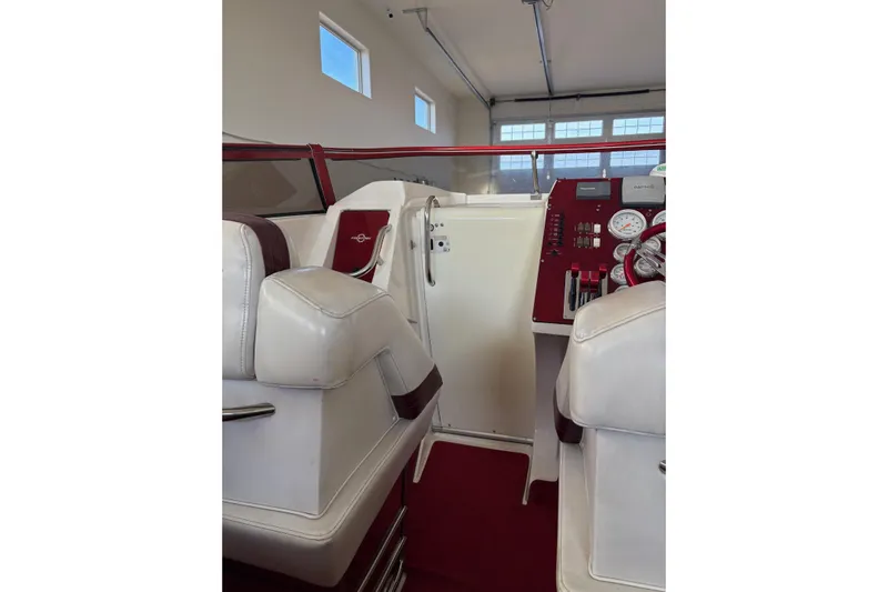  Yacht Photos Pics Interior of 2006 Fountain 42 Lightning boat with red and white seating.