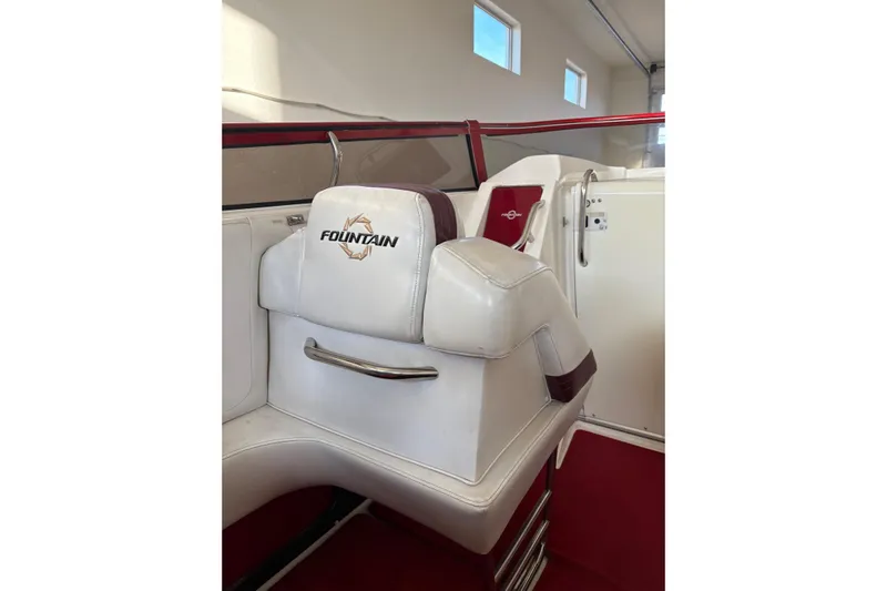  Yacht Photos Pics Interior of 2006 Fountain 42 Lightning boat with white and red seating.