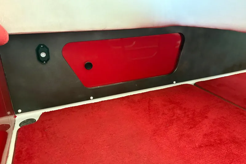  Yacht Photos Pics Interior of 2006 Fountain 42 Lightning boat with red carpet and paneling.