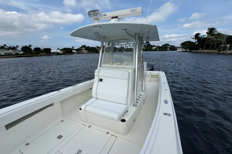  Yacht Photos Pics 2013 SeaVee 320B boat on calm water, featuring a sleek white design and spacious deck.