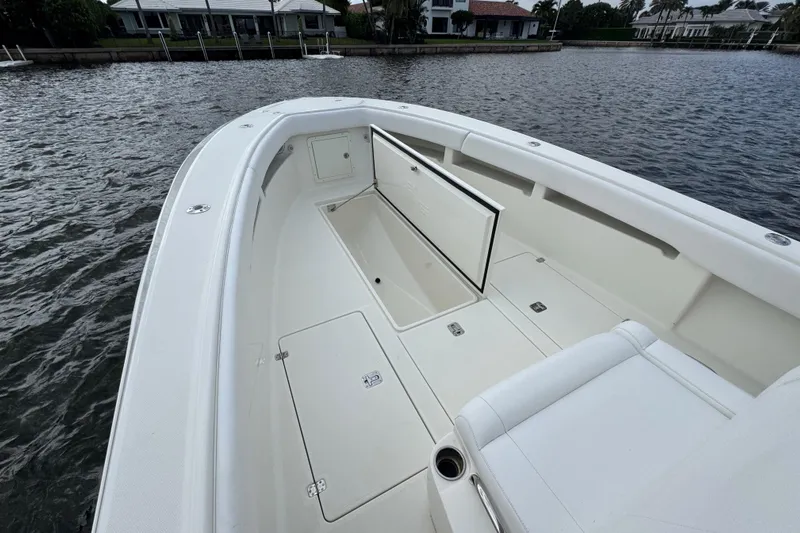  Yacht Photos Pics 2013 SeaVee 320B boat interior with open storage compartments on calm water.