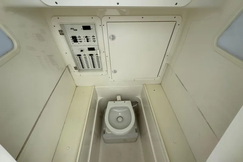  Yacht Photos Pics 2013 SeaVee 320B boat interior with toilet and control panel.