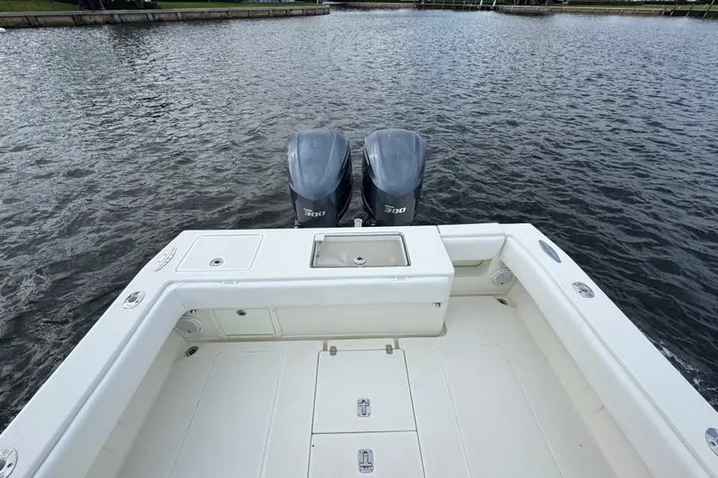  Yacht Photos Pics 2013 SeaVee 320B boat with dual 300 horsepower engines on calm water.