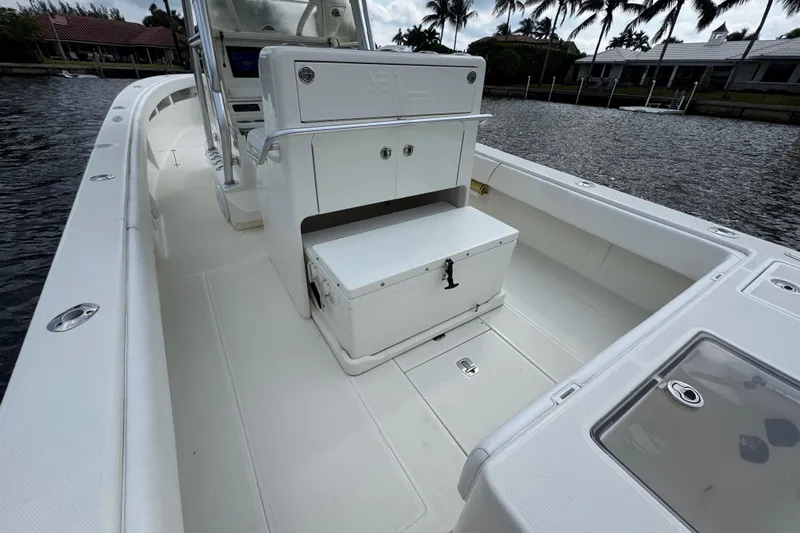  Yacht Photos Pics 2013 SeaVee 320B boat interior with seating and storage, docked by palm trees.