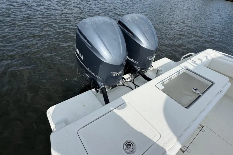  Yacht Photos Pics Twin Yamaha 300 engines on a 2013 SeaVee 320B boat, docked on water.