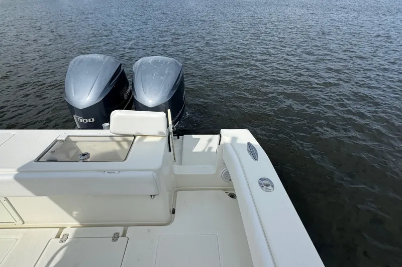  Yacht Photos Pics 2013 SeaVee 320B boat with dual outboard engines on calm water.