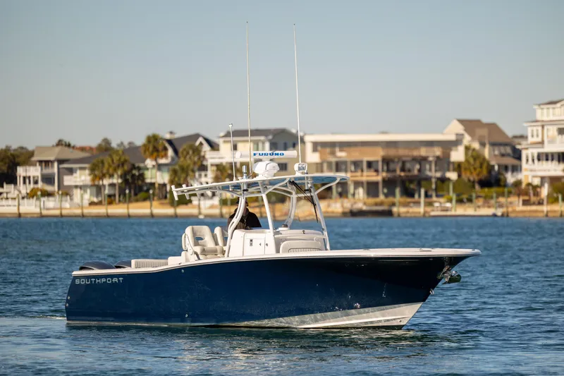 Seachosis Yacht Photos Pics 2014 Southport 29TE boat on water near coastal homes.