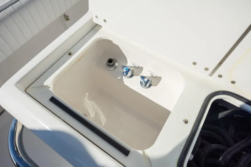 Seachosis Yacht Photos Pics 2014 Southport 29TE boat sink with faucet controls and storage compartment.