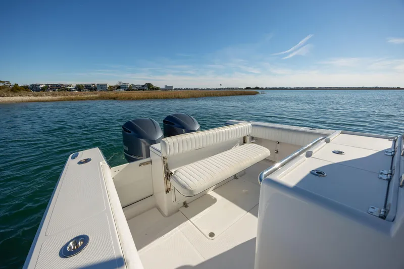 Seachosis Yacht Photos Pics 2014 Southport 29TE boat with dual engines on a calm water backdrop.