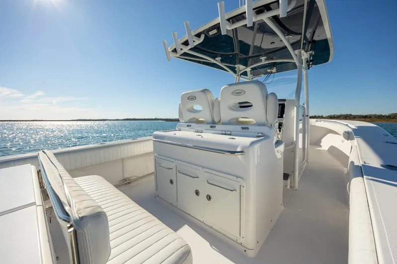 Seachosis Yacht Photos Pics 2014 Southport 29TE boat interior with seating and helm, on a sunny day.