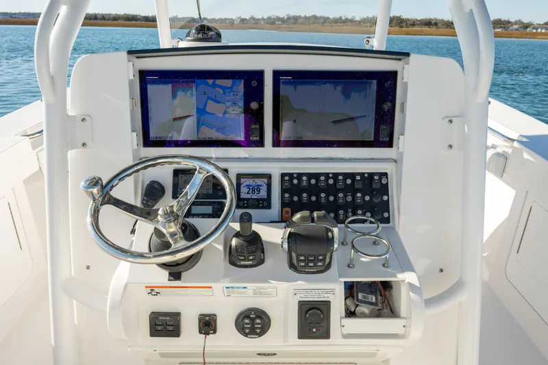 Seachosis Yacht Photos Pics Control panel of a 2014 Southport 29TE boat with dual navigation screens.