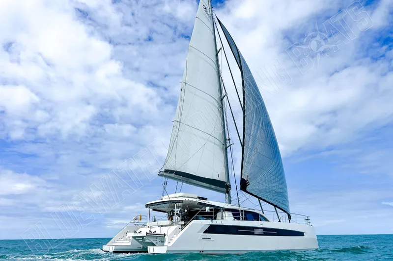 Fun Pass Yacht Photos Pics Sailing catamaran Privilege 580, 2025 model, cruising on open sea under clear skies.