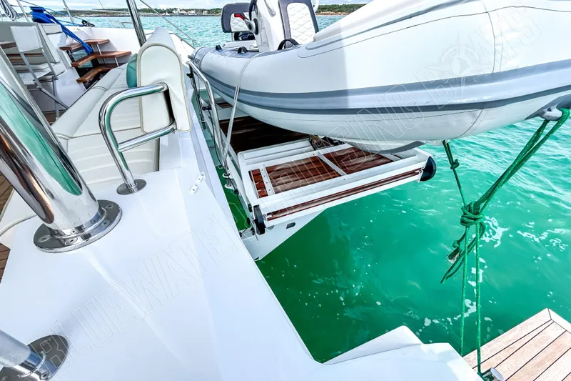 Fun Pass Yacht Photos Pics Luxury Privilege 580 yacht with tender, docked on turquoise water, 2025 model.