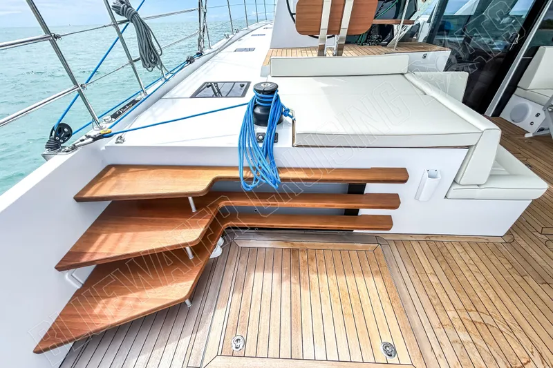 Fun Pass Yacht Photos Pics Luxury Privilege 580 yacht deck with wooden steps and seating, 2025 model.