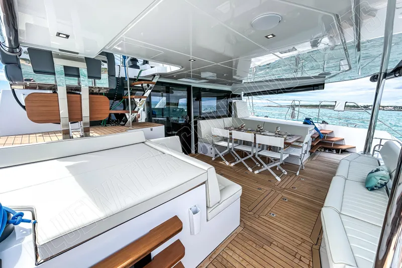 Fun Pass Yacht Photos Pics Luxurious 2025 Privilege 580 yacht interior with elegant seating and dining area.