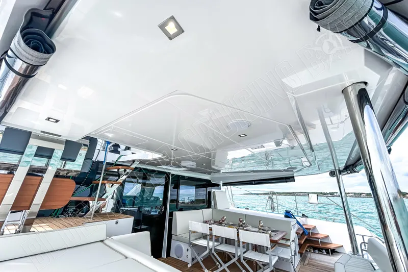 Fun Pass Yacht Photos Pics Luxurious 2025 Privilege 580 yacht interior with elegant dining area and modern design.