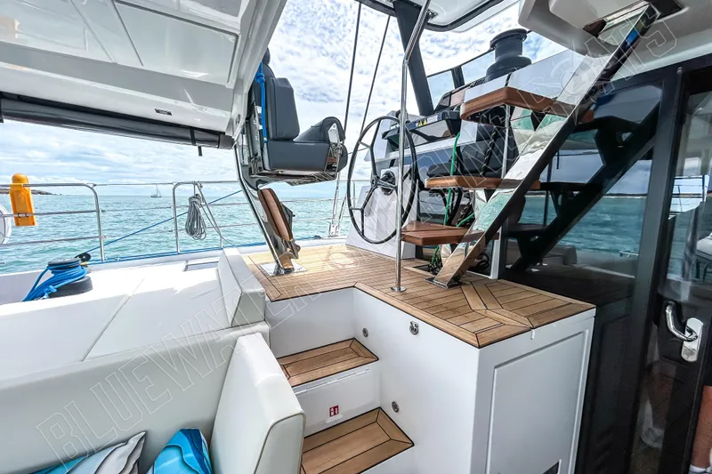 Fun Pass Yacht Photos Pics Luxurious Privilege 580 yacht interior with modern helm and wooden stairs, 2025 model.