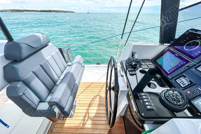 Fun Pass Yacht Photos Pics Helm of 2025 Privilege 580 yacht with modern navigation equipment and ocean view.