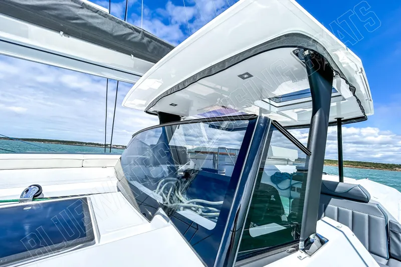 Fun Pass Yacht Photos Pics 2025 Privilege 580 yacht cockpit with sleek design and modern features on open water.