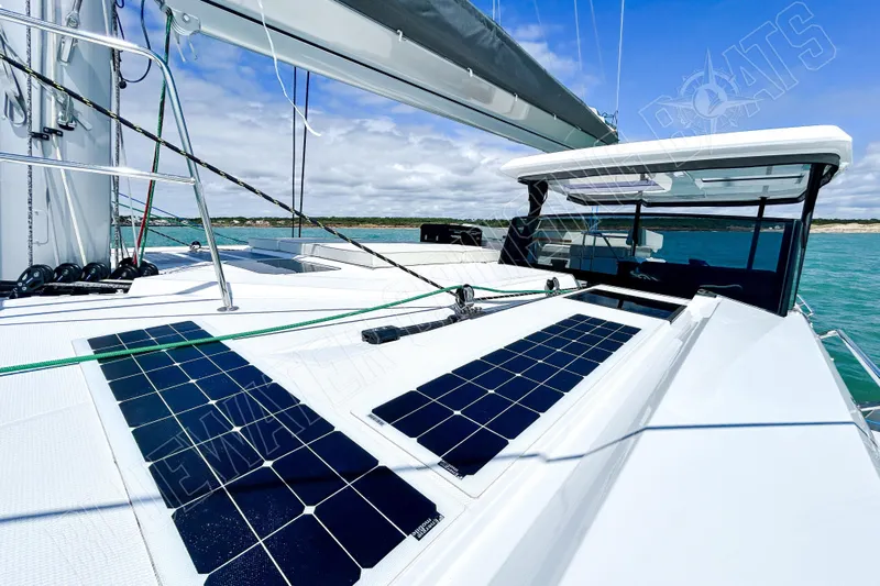 Fun Pass Yacht Photos Pics Luxury Privilege 580 yacht with solar panels, 2025 model, sailing on turquoise waters.