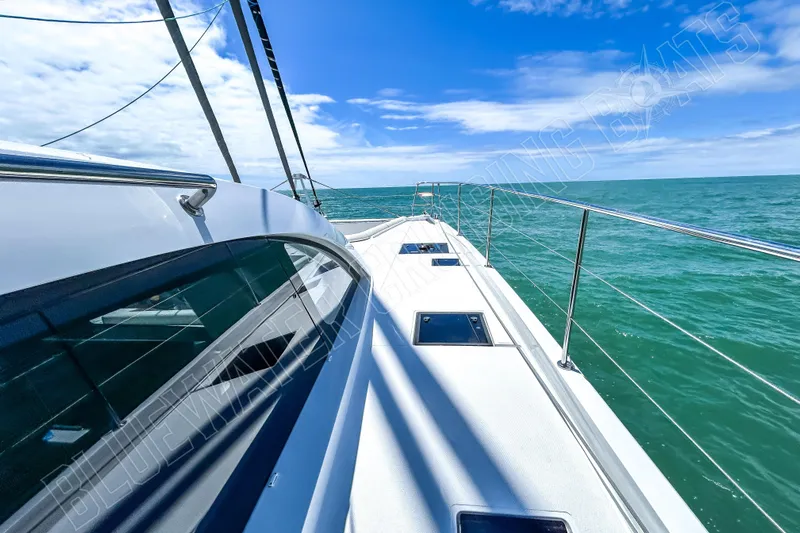 Fun Pass Yacht Photos Pics Sleek Privilege 580 yacht deck cruising on open sea, 2025 model.