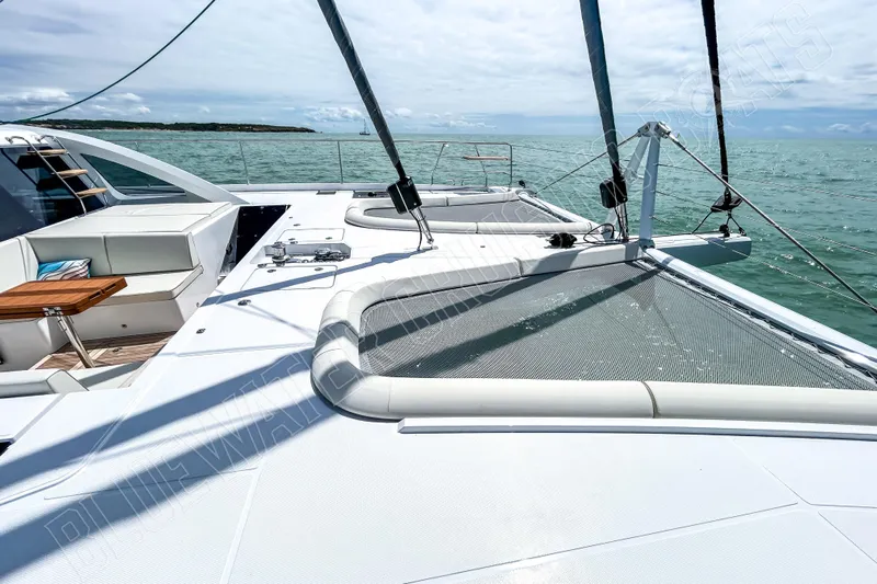 Fun Pass Yacht Photos Pics Luxury Privilege 580 yacht deck, 2025 model, sailing on calm ocean waters.